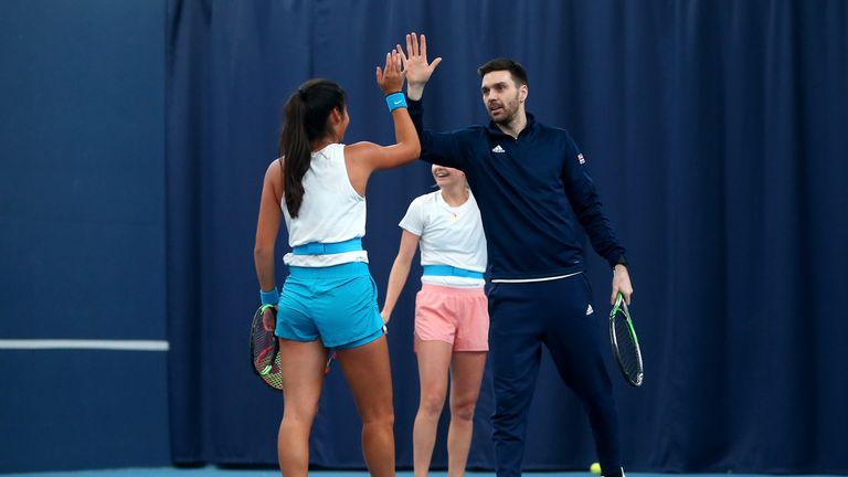 Emma Raducanu of Great Britain and Colin Fleming during a practice session ahead of the start of the Fed Cup Europe and Africa Zone Group I fixtures at University of Bath on February 03, 2019 in Bath, England.