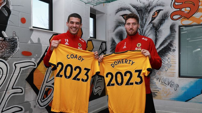 Conor Coady and Matt Doherty pose after signing their contract extensions