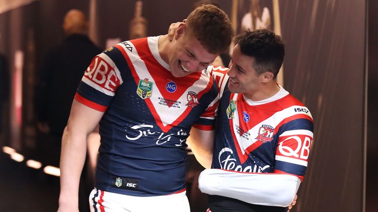 Cooper Cronk (R) celebrates after the NRL Grand Final with Dylan Napa