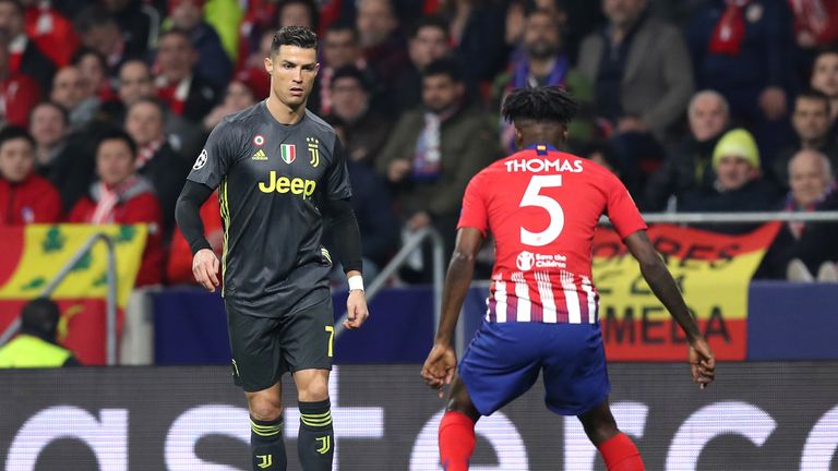 Cristiano Ronaldo tries to get past Atletico Madrid's Thomas Partey