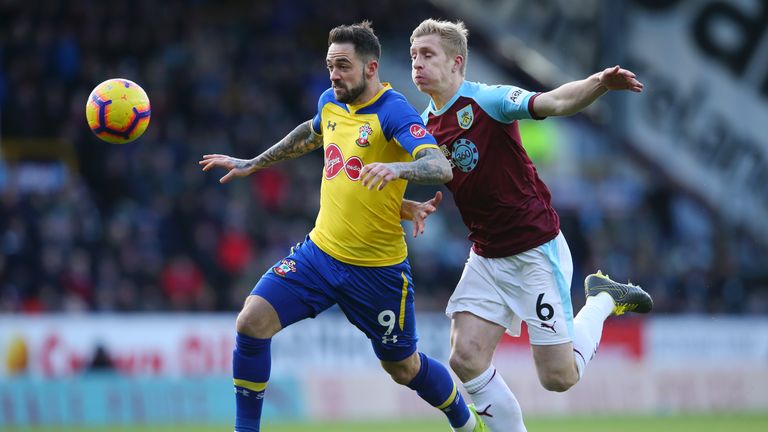 Danny Ings of Southampton is challenged by Ben Mee of Burnley