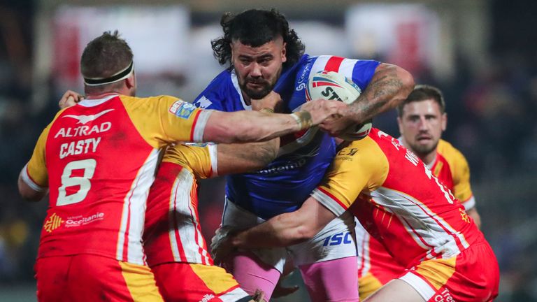 David Fifita is tackled by Catalans' Remi Casty, Sam Moa and Matt Whitley