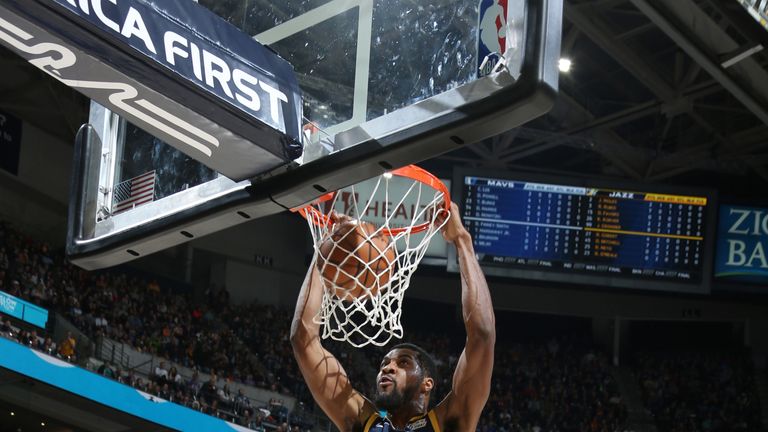 Derrick Favors dunks for the Jazz during their win over the Mavericks