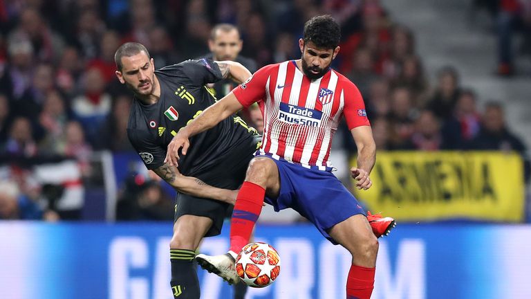 Atletico Madrid striker Diego Costa is challenged by Juventus' Leonardo Bonucci 