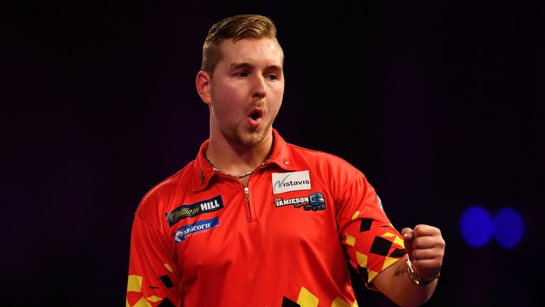 Dimitri Van Den Bergh celebrates during his Quarter Final Match against Rob Cross during the 2018 William Hill PDC World Darts Championships on Day Thirteen at Alexandra Palace on December 29, 2017 in London, England. 