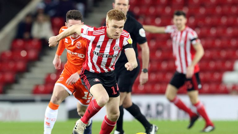 Duncan Watmore pulls away from a Blackpool player during the Sky Bet League One match at Stadium of Light on February 12, 2019