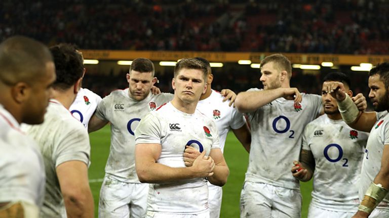 England's players look on in dejection after coming up short in Wales