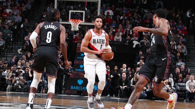Evan Turner of the Portland Trail Blazers passes the ball during the game against the Brooklyn Nets