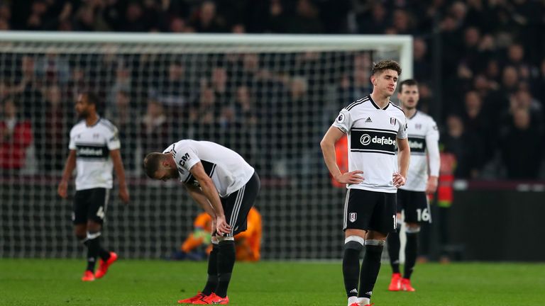Fulham&#39;s players look dejected after their Premier League defeat at West Ham United. 