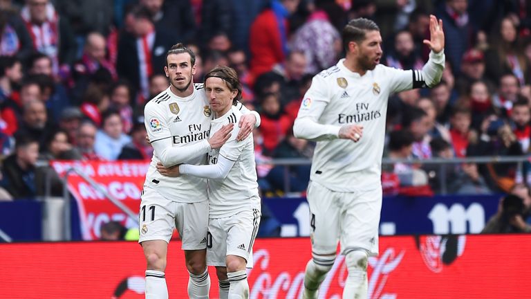 Gareth Bale celebrates with Luka Modric after scoring for Real Madrid against Atletico