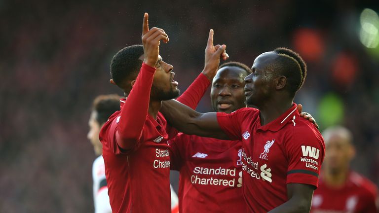 Georginio Wijnaldum celebrates with Sadio Mane and Naby Keita after scoring Liverpool's second goal