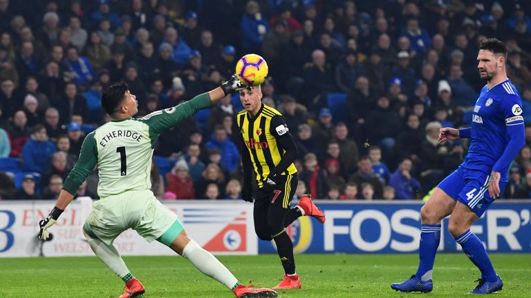 Gerard Deulofeu of Watford beats Neil Etheridge of Cardiff City as he scores his team's thrd goal during the Premier League match between Cardiff City and Watford FC at Cardiff City Stadium on February 22, 2019 in Cardiff, United Kingdom