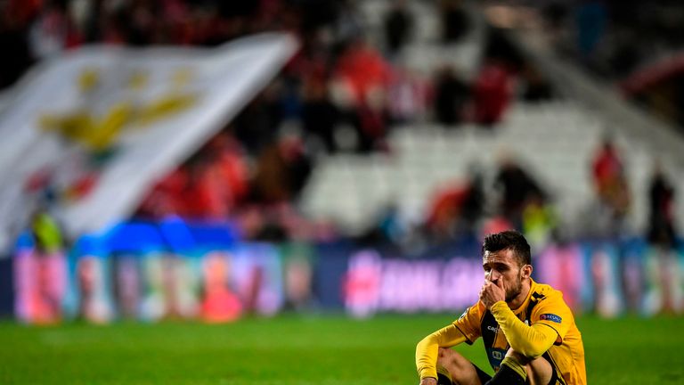 AEK's midfielder Yannis Gianniotas reacts to their defeat at the end of the UEFA Champions League group E football match between SL Benfica and AEK Athens FC at the Luz stadium in Lisbon on December 12, 2018.