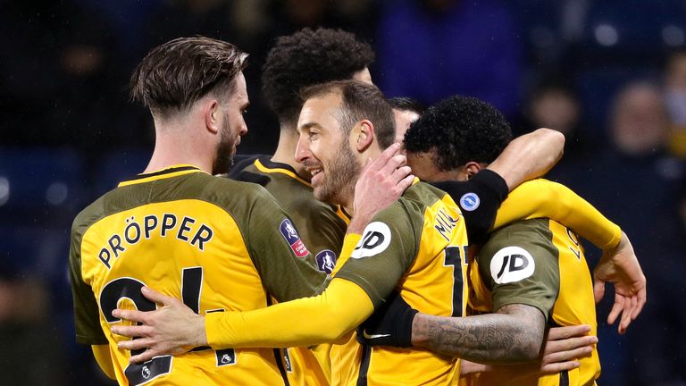 Brighton & Hove Albion's Glenn Murray (centre) celebrates scoring his sides second goal of the game with teammates during the FA Cup fourth-round replay match at The Hawthorns, West Bromwich. 