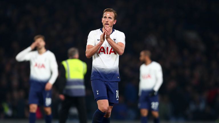 Harry Kane applauds the travelling Tottenham fans after defeat against Chelsea
