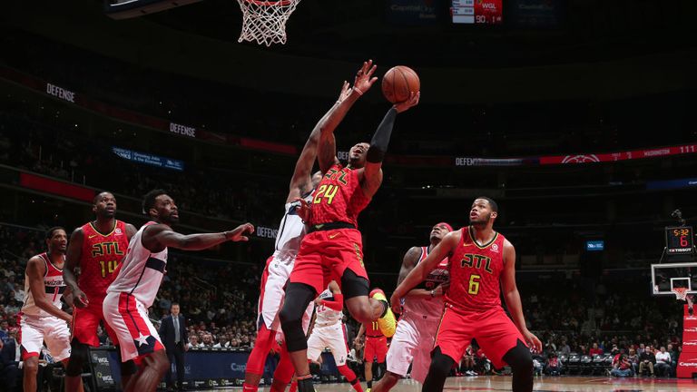 Kent Bazemore of the Atlanta Hawks goes to the basket against the Washington Wizards