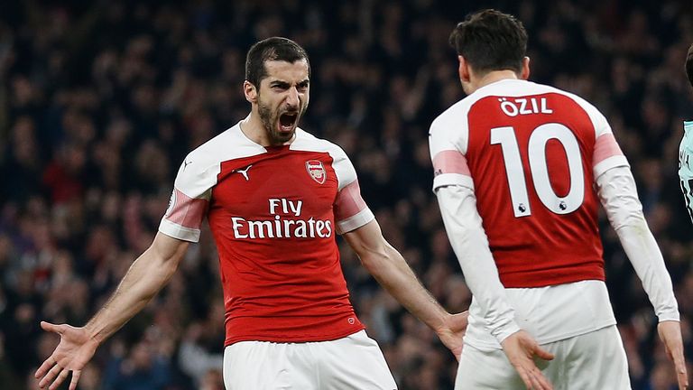 Henrikh Mkhitaryan celebrates scoring Arsenal's second goal with Mesut Ozil