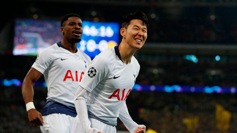 Heung -min Son celebrates with Serge Aurier after scoring Tottenham's opening goal