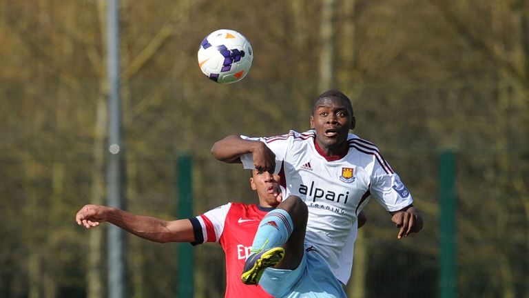 Isaac Hayden of Arsenal and Jordan Brown of West Ham at London Colney on March 24, 2014 in St Albans, England.