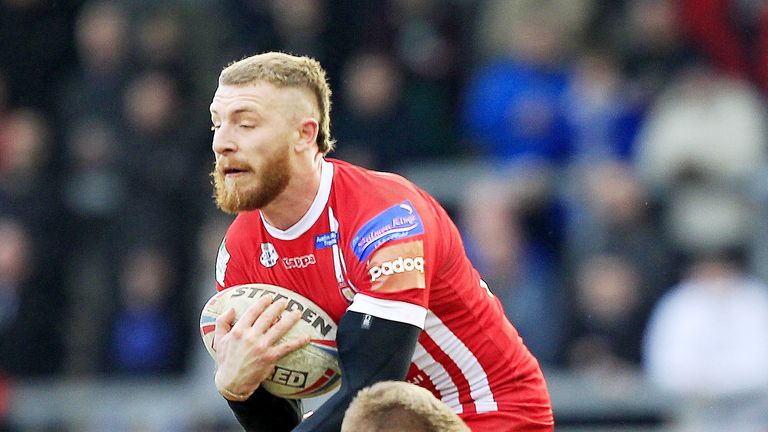 Salfords Jackson Hastings tackled by Leeds Brad Dwyer