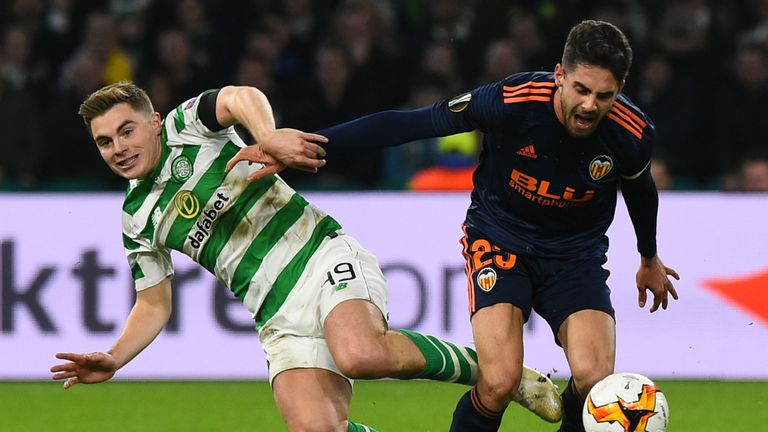 Celtic's Scottish midfielder James Forrest (L) battles with Valencia's Spanish forward Ruben Sobrino 