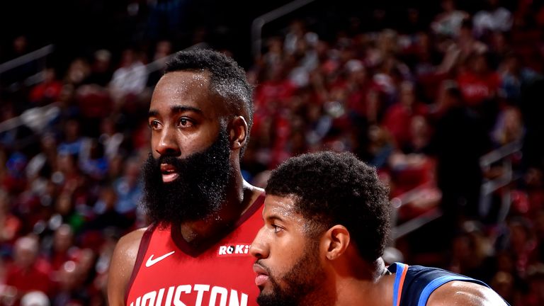 James Harden #13 of the Houston Rockets on guard against Paul George #13 of the Oklahoma City Thunder on December 25, 2018 at the Toyota Center in Houston, Texas.