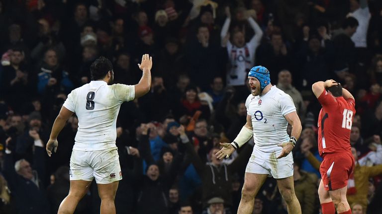 Billy Vunipola (left) and England's flanker James Haskell (2R) celebrates at the final whistle in the Six Nations international rugby union match between Wales and England at the Millennium Stadium in Cardiff, south Wales, on February 6, 2015. The match ended Wales 16, England 21