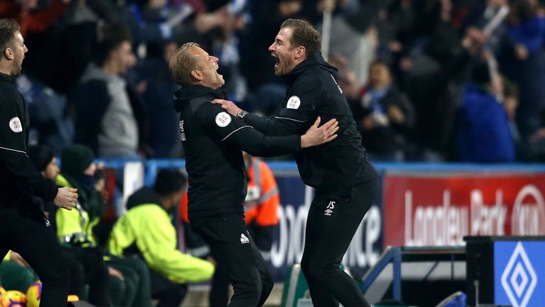 Jan Siewert celebrates the Terriers' stoppage-time winner against Wolves with assistant coach Andreas Winkler