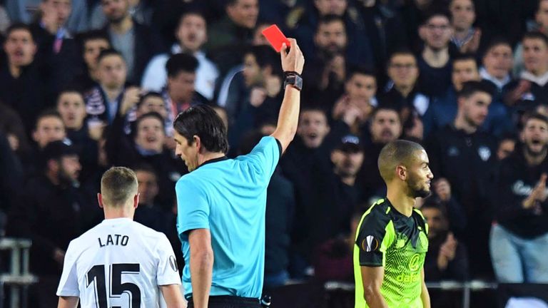 Celtic's Jeremy Toljan is shown a red card during the Europa League last-32 second leg against Valencia