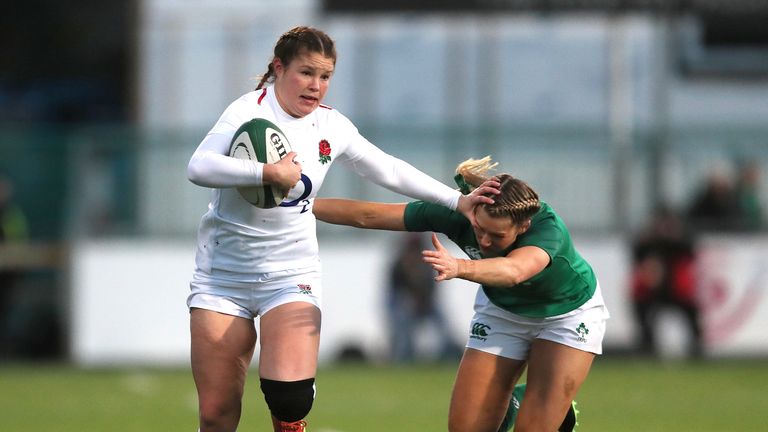 Jess Breach goes past Ireland&#39;s Megan Williams to score