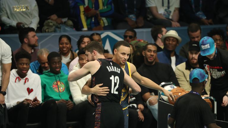 Joe Harris #of the Brooklyn Nets hugs Stephen Curry of the Golden State Warriors during the 2019 3-Point Contest as part of All-Star Saturday Night