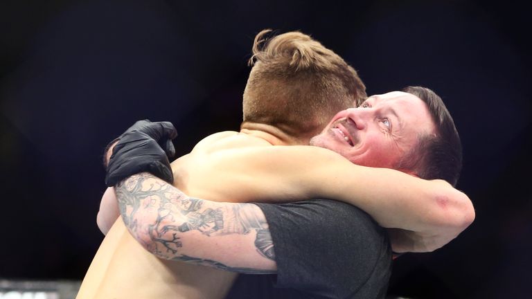 Brad Katona of Canada celebrates with coach John Kavanagh after victory against Matthew Lopez of the United States in a bantamweight bout during the UFC 231 event at Scotiabank Arena on December 8, 2018 in Toronto, Canada.