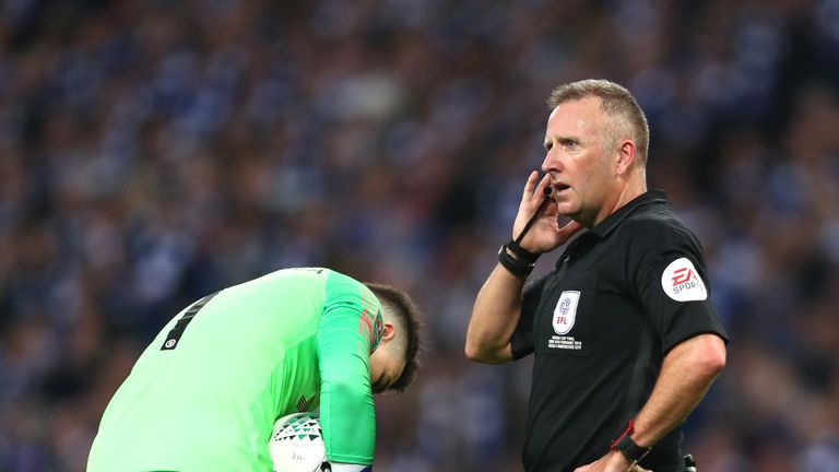 John Moss tries to get clarification over Kepa Arrizabalaga's substitution during the Carabao Cup final
