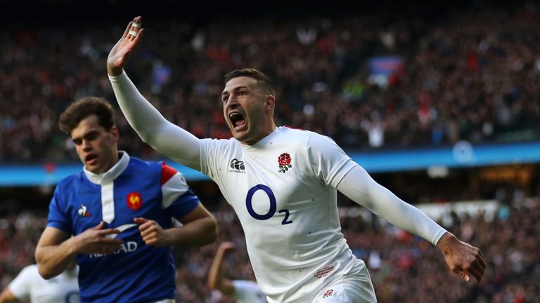 Jonny May celebrates scoring a try against France