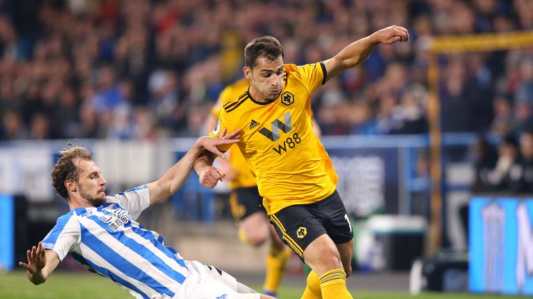 Jonny Otto of Wolverhampton Wanderers is tackled by Jon Gorenc Stankovic of Huddersfield Town at the John Smith's Stadium