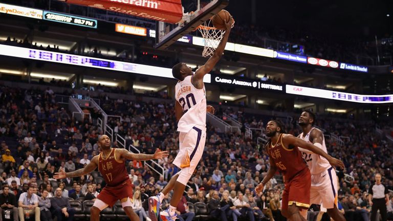 Josh Jackson of the Phoenix Suns attempts a shot ahead of PJ Tucker of the Houston Rockets