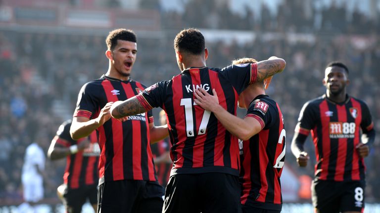 Josh King celebrates with Bournemouth team-mates after going ahead against Wolves
