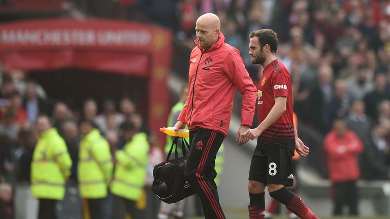 Juan Mata leaves the pitch after picking up an injury