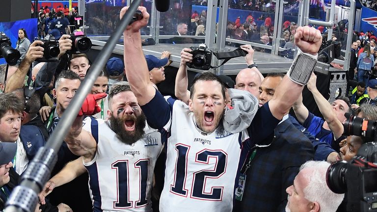 Julian Edelman and team-mate Tom Brady celebrate the 13-3 win over the LA Rams at Super Bowl LIII