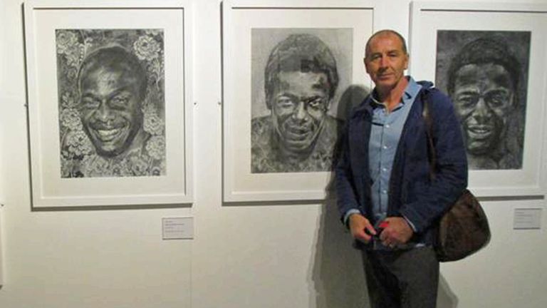 Artist Colin Yates poses with his Justin Fashanu Triptych at the Black Looks exhibition at the National Football Museum in October 2018 - January 2019 (picture: footballfineart.com)