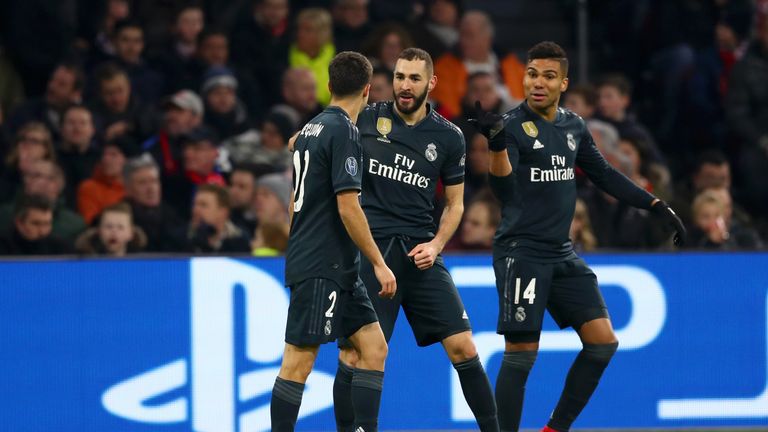 Karim Benzema (centre) celebrates scoring for Real Madrid against Ajax