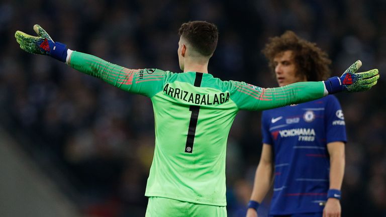 Kepa Arrizabalaga throws his arms out in frustration and refuses to be substituted during the Carabao Cup Final