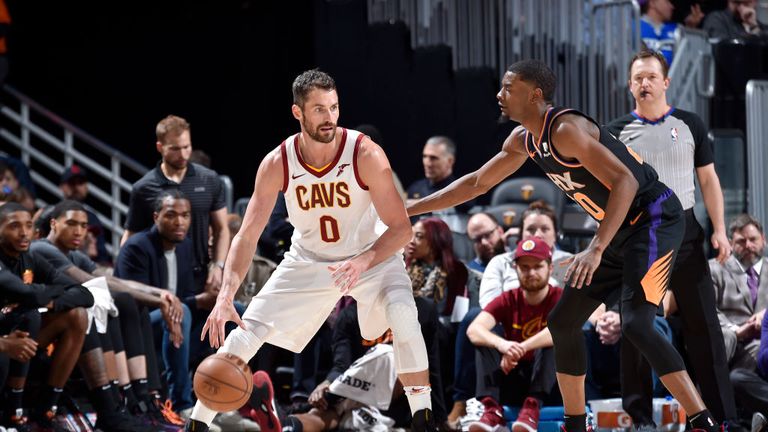 Kevin Love of the Cleveland Cavaliers handles the ball against the Phoenix Suns 