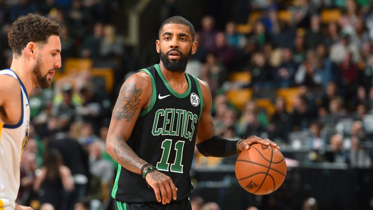 Kyrie Irving #11 of the Boston Celtics handles the ball against the Golden State Warriors on January 26, 2019 at the TD Garden in Boston, Massachusetts. 