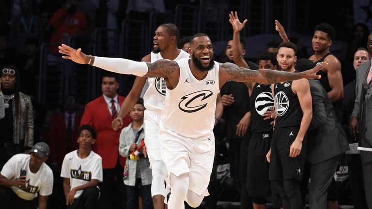 LeBron James celebrates as Steph Curry looks on at the end of the 2018 All-Star Game