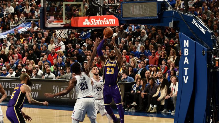 LeBron James of the Los Angeles Lakers shoots the ball against the Philadelphia 76ers