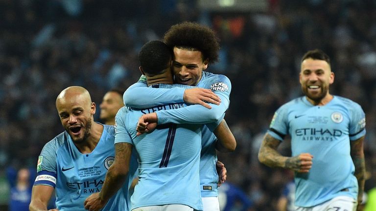 Leroy Sane embraces Manchester City's match winner Raheem Sterling