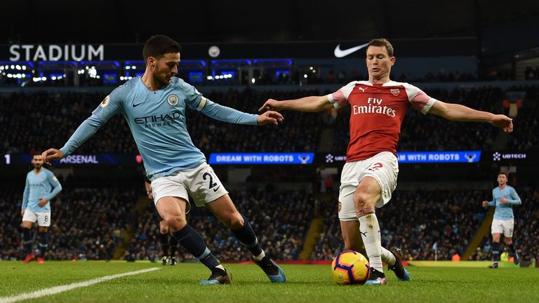 Stephan Lichtsteiner (right) suffered a torrid day against Manchester City