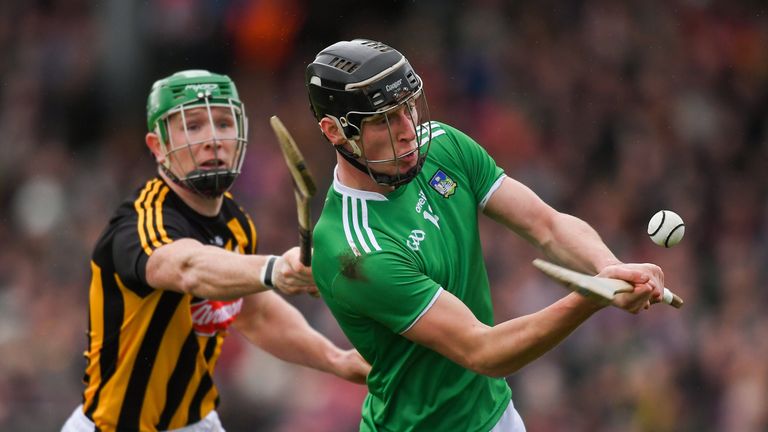 Conor Boylan of Limerick scores a point despite the efforts of Paul Murphy