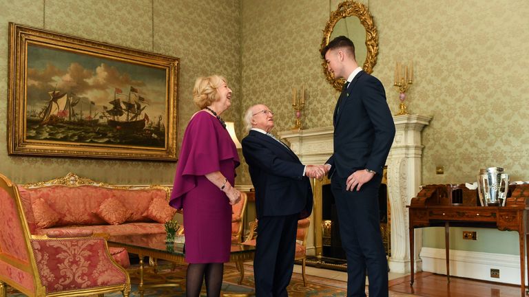The President of Ireland Michael D Higgins shakes hands with Kyle Hayes